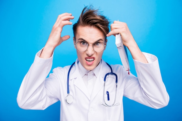 Photo portrait of a cheerful scientist on a blue background