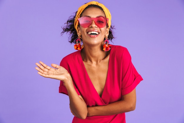 Portrait of a cheerful young african woman in headband