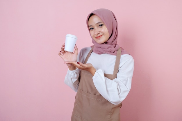 Portrait cheerful young asian woman with white cup or glass