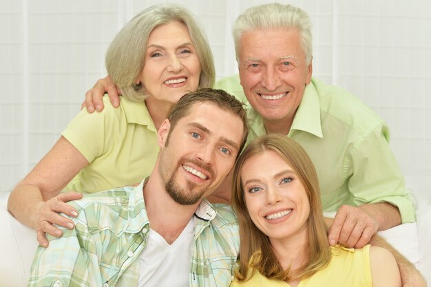 Portrait of a cheerful young couple with senior parents