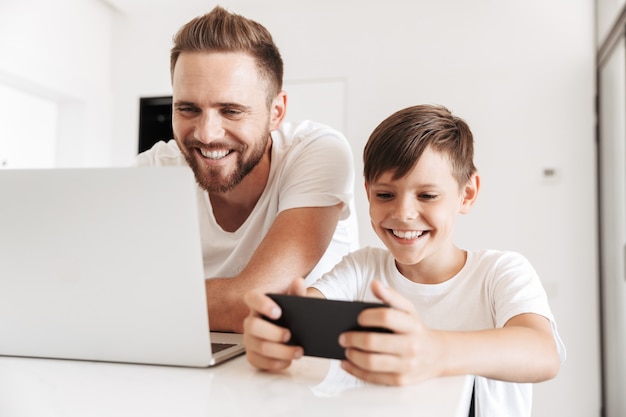 Portrait of a cheerful young father and his son