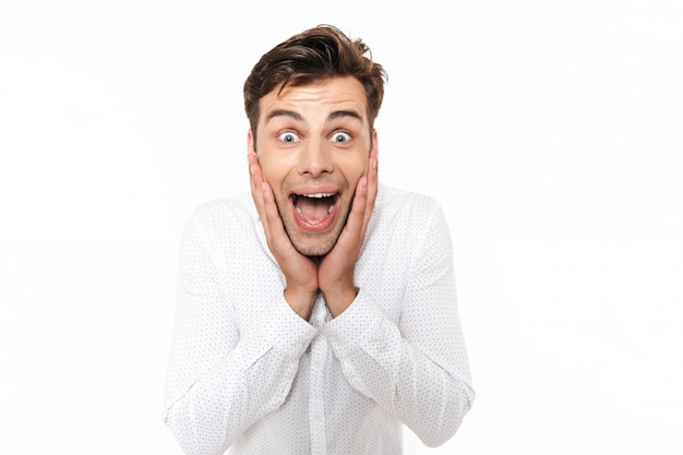 Portrait of a cheerful young man in shirt