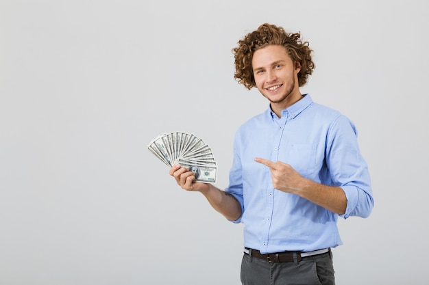 Portrait of a cheerful young man with curly hair