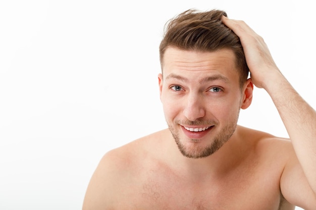 Portrait of a cheerful young naked man