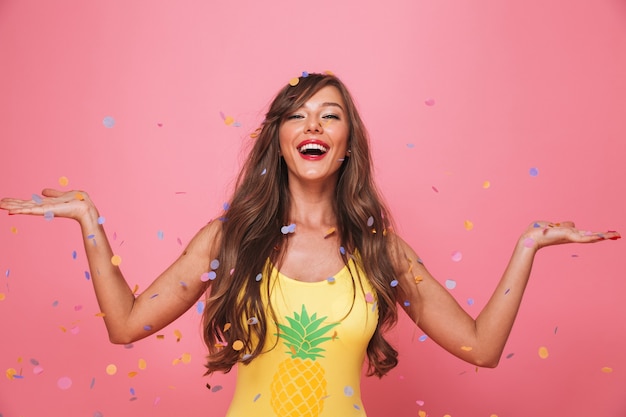 Portrait of a cheerful young woman dressed in swimsuit