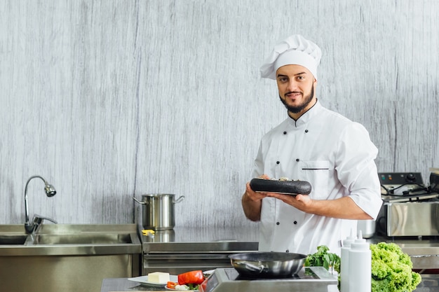 Portrait of the chef in the kitchen of the restaurant with a ready madeeggs