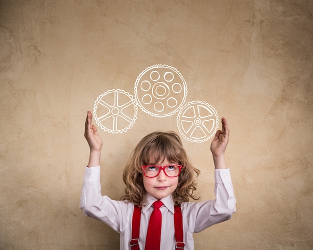 Portrait of child businessman in office. Smart kid in class