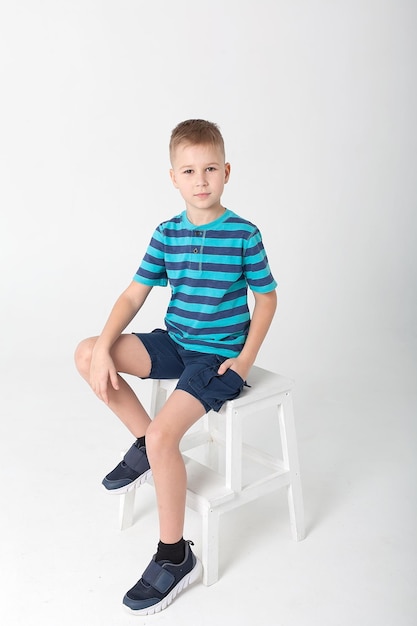 Portrait of child handsome little boy in jeans wear 8 years old kid