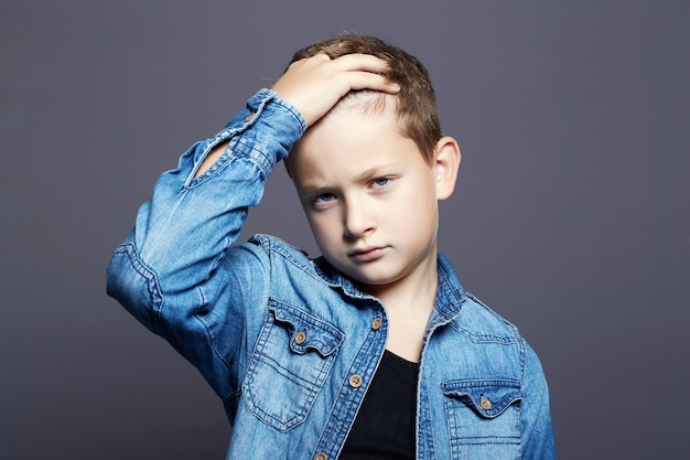 Portrait of child handsome little boy in jeans