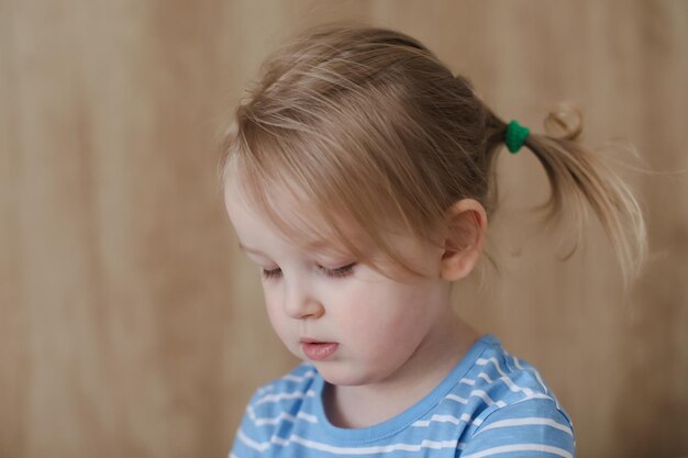 Portrait of child indoors Happy funny toddler girl at home