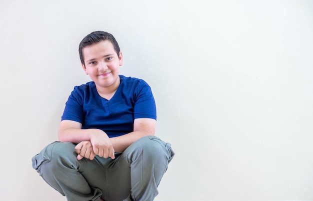 Portrait for a child sitting in the school corridor