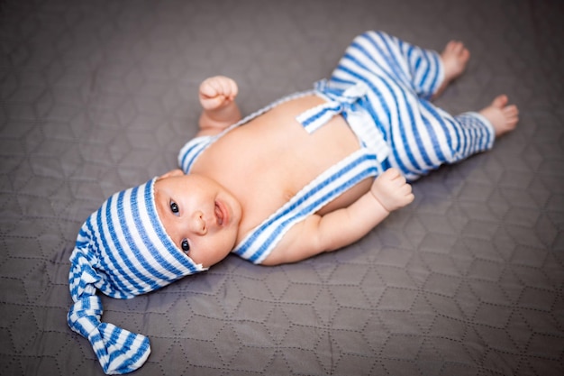 Portrait of child smilling Cute small baby lying on the bed