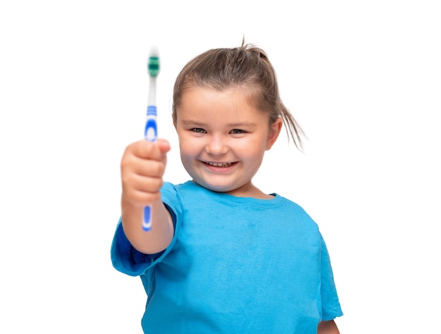 Portrait of a child with a toothbrush isolated