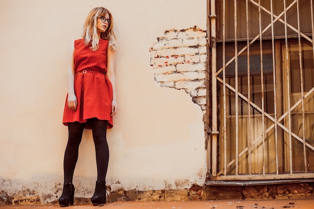 Portrait of the city girl. Posing in the courtyard, rooftop.Summer day.