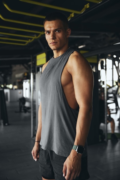 Portrait close up of a fit caucasian male athlete after a workout in the gym a focused fitness coach