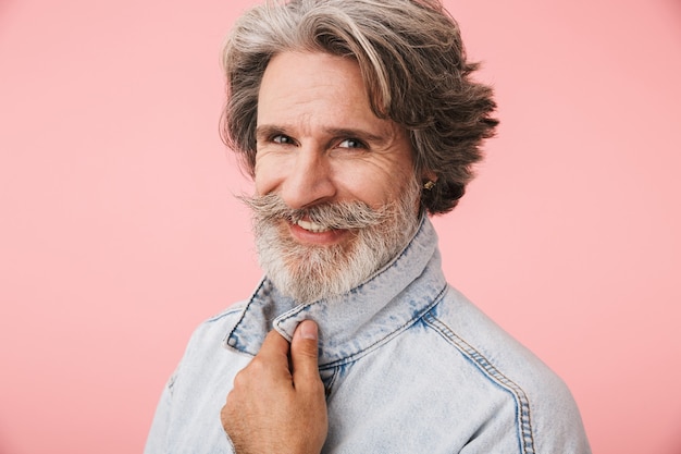 Portrait closeup of handsome mature man 70s with gray beard smiling isolated