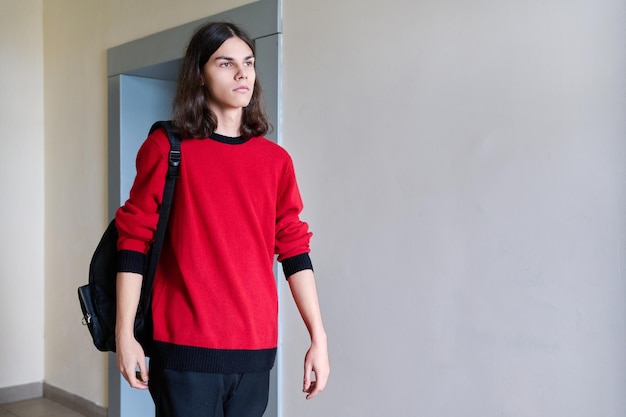 Portrait of college student guy with backpack