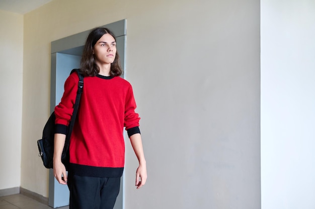 Portrait of college student guy with backpack