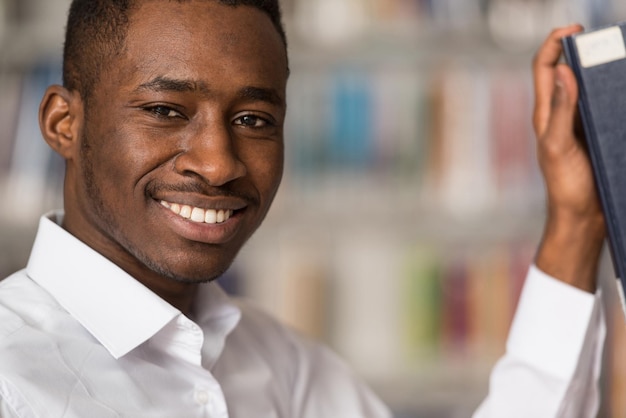 Portrait Of A College Student Man In Library  Shallow Depth Of Field