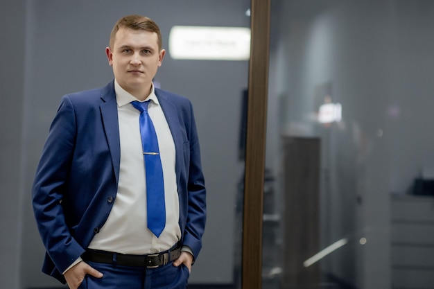 Portrait of concentrated lawyer working at workplace with documents in office.