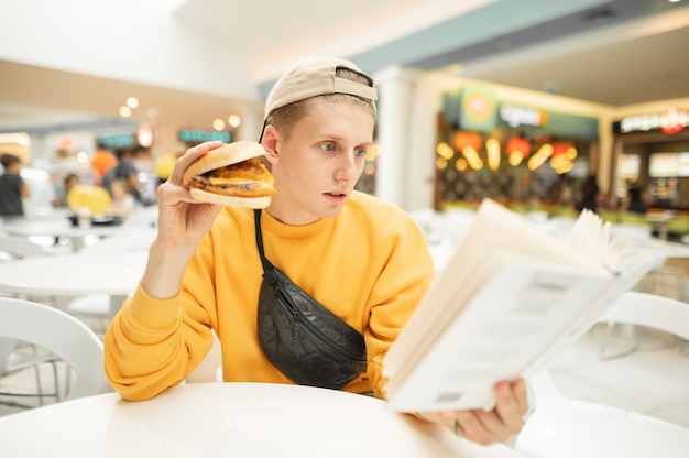 Portrait of a concentrated young man in stylish light clothing