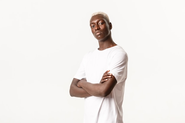 Portrait of confident assertive african-american guy with blond hair