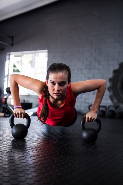 Portrait of confident athlete doing push-ups