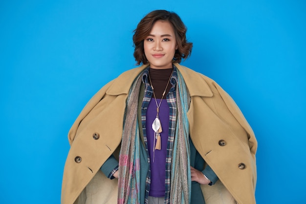 Portrait confident attractive young woman in turtleneck, shirt\
and jacket under warm wool coat