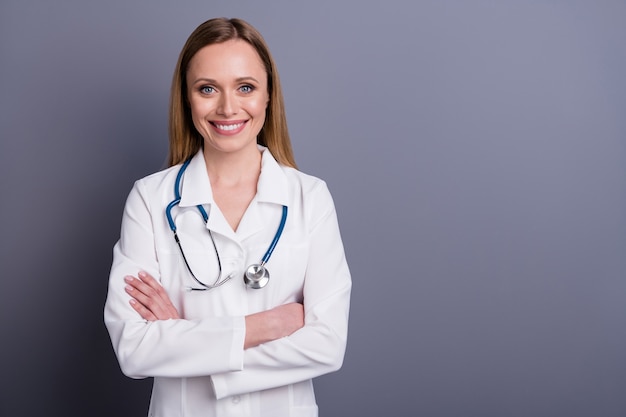 Portrait of confident blonde girl doc qualified specialist expert folded arms