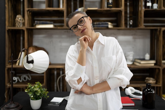 Portrait of confident boss broker in office space