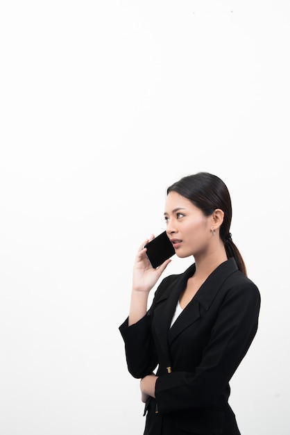 Portrait of Confident business woman using on the mobile cell phone isolated on white background.