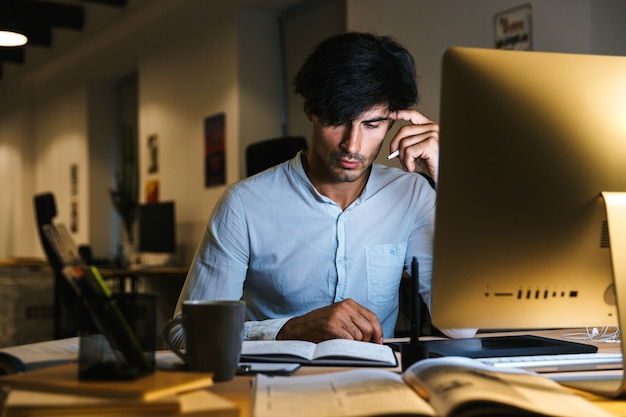 Portrait of a confident concentrated businessman working