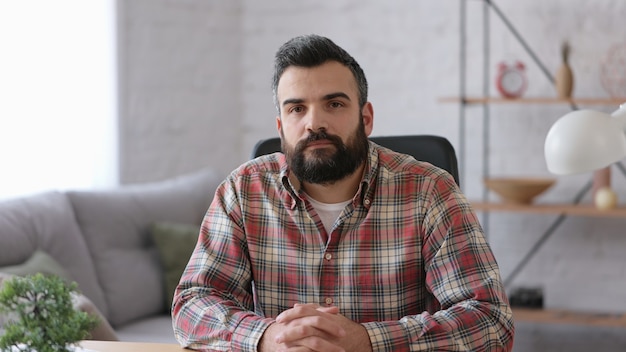 Portrait of confident handsome bearded man. Beautiful human face.