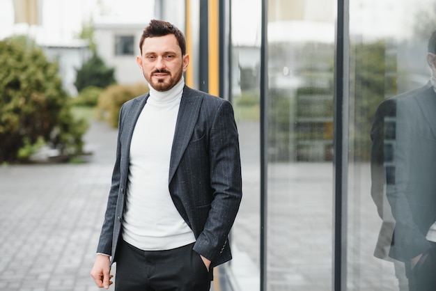 Portrait of a confident mature businessman standing outside