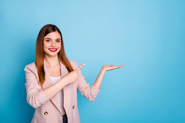 Portrait of confident positive girl promoter point index finger hold hand copyspace