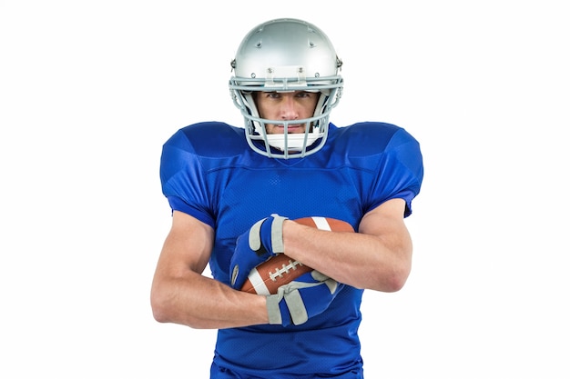 Portrait of confident sportsman holding ball