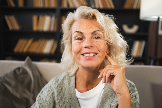 Portrait of confident stylish european middle aged senior woman older mature s lady smiling at home