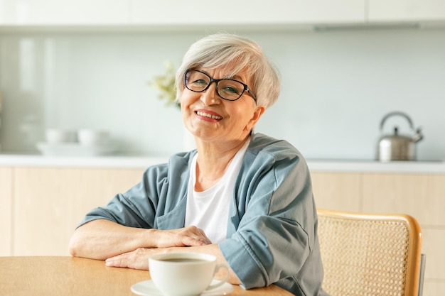 Photo portrait of confident stylish european middle aged senior woman older mature s lady smiling at home