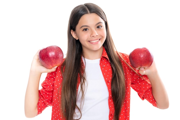 Portrait of confident teen girl with apple going to have healthy snack Health nutrition dieting and kids vitamins Portrait of happy smiling teenage child girl