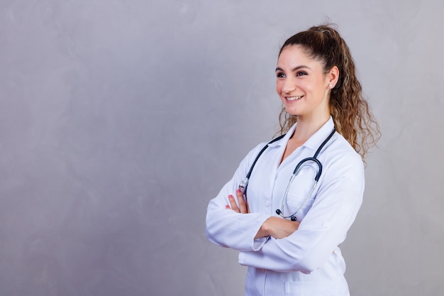 Portrait of confident with toothy beaming smile qualified experienced clever intelligent doctor wearing white formal wear