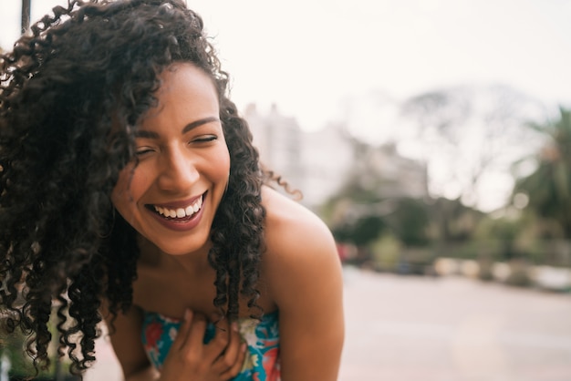 Portrait of confident woman laughing.