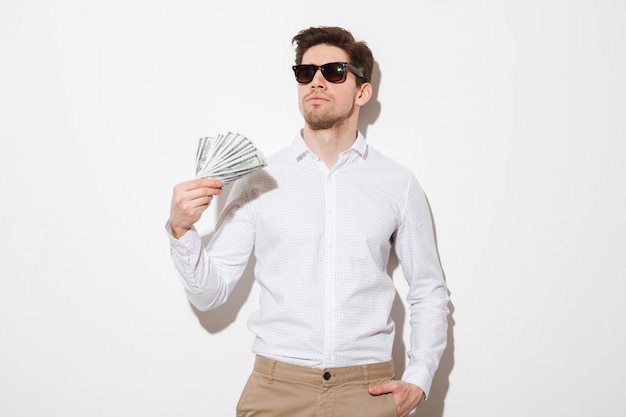 Portrait of a confident young man in sunglasses