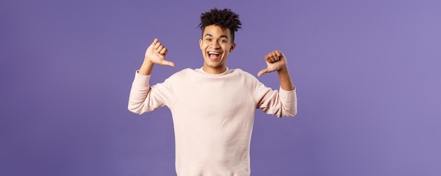 Portrait of confident young upbeat man smiling bragging being boastful about own accomplishments ind