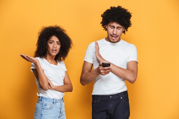 Portrait of a confused afro american couple