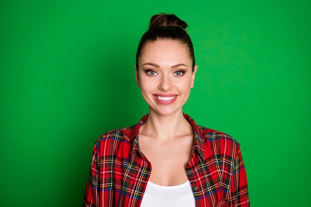 Portrait of content sweet attractive girl look in camera toothy smiling wear checked shirt isolated over bright color background