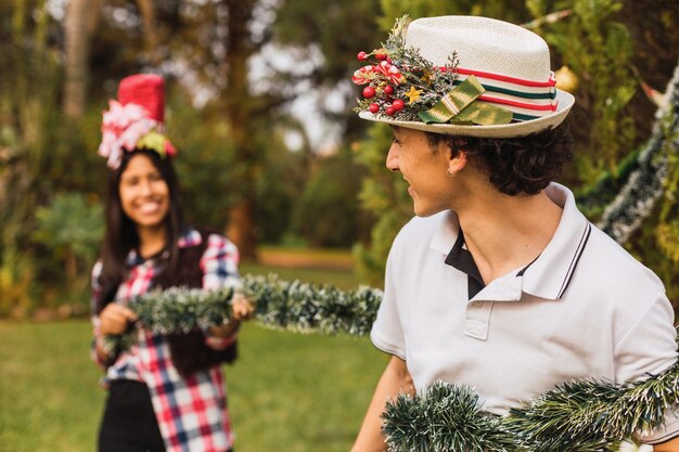 Portrait of a couple decorating the Christmas tree