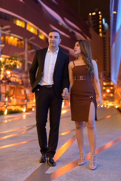 Portrait of couple outdoors at night in the city at Bangkok Thailand