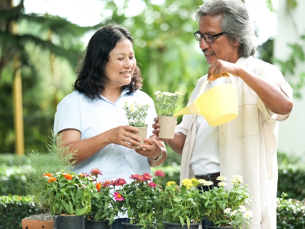 Portrait of couple senior in the flower garden