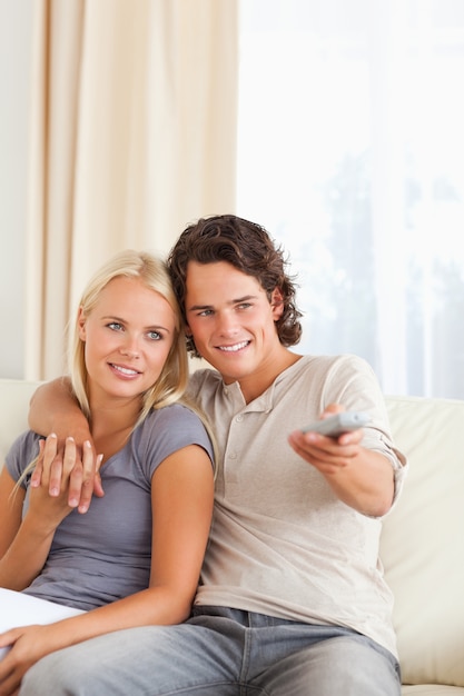 Portrait of a couple watching TV