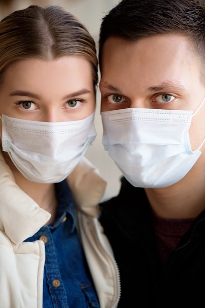 portrait of couple wearing medical masks